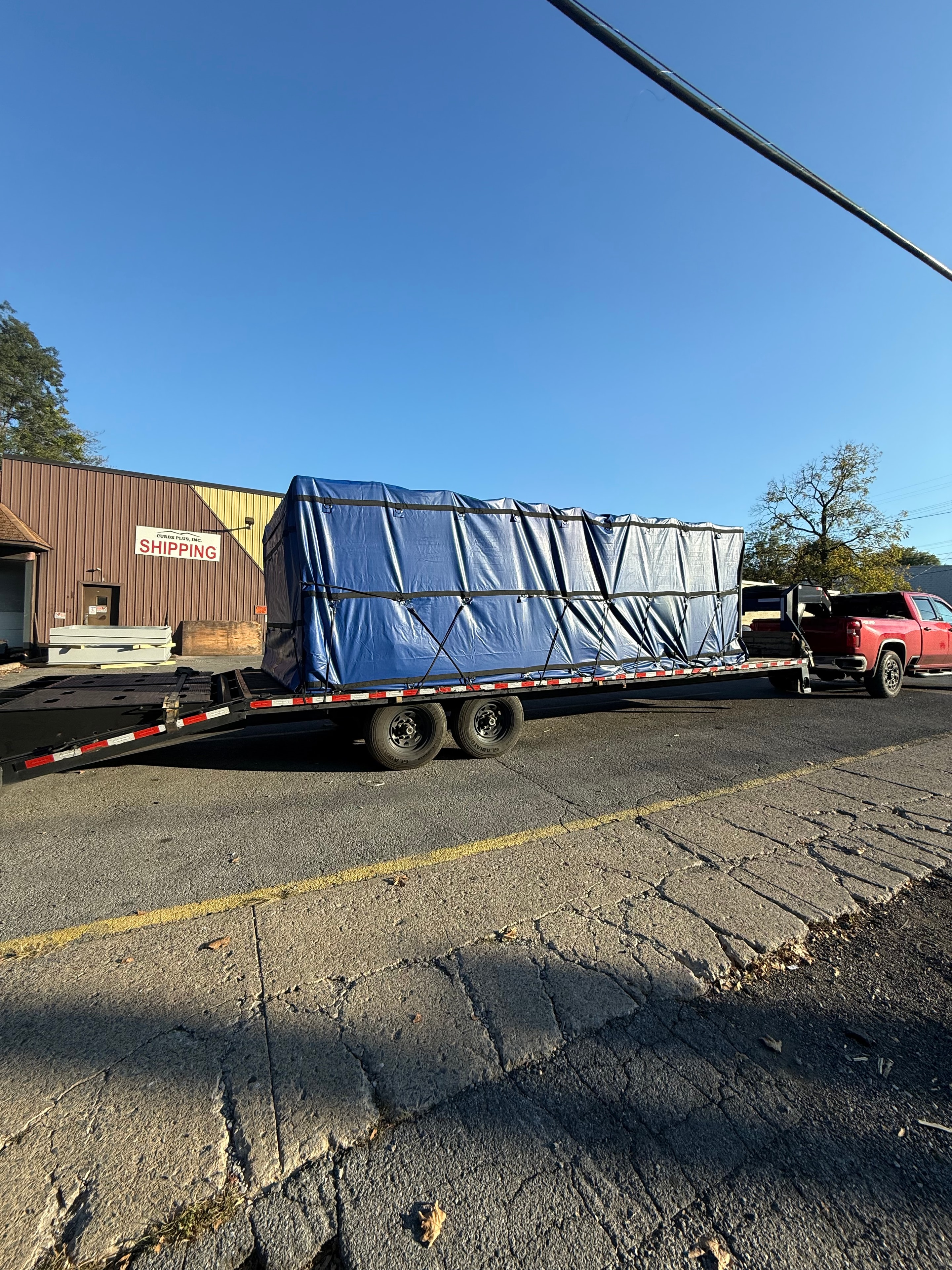 Tarped freight load on flatbed trailer